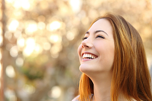 Portrait of a woman laughing with a perfect teeth